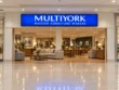 Front view of the Multiyork indoor light box sign above a wide furniture store entrance viewed from the shopping mall corridor.