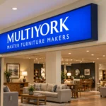Alternate angled view of the Multiyork indoor light box sign showing its dark cabinet profile, blue face, and white lettering.
