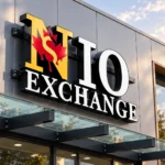 custom channel letter signs - NIO Exchange dimensional storefront sign with white and yellow lettering, black sides, and a red maple leaf logo.