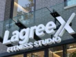 Close-up of the Lagree X Fitness Studio custom channel letter sign, highlighting the white faces, letter edges, and mounting framework.