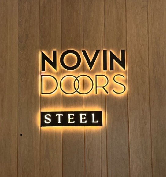 NOVIN DOORS STEEL halo-lit reception sign recently fabricated and installed by ASC Signs