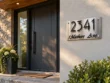 Brushed stainless steel address sign 2341 Mathers Ave beside a contemporary home entrance